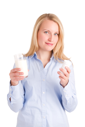 woman with milk and supplements