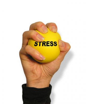 woman squeezing stress ball