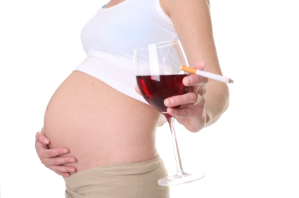 Pregnant woman with wine and cigarette