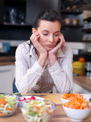 Depressed woman uninterested in food